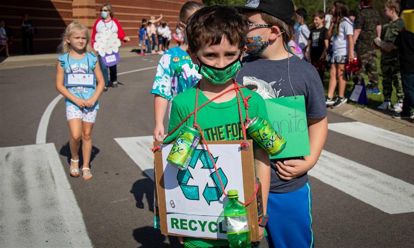 Students walk in a vocabulary parade